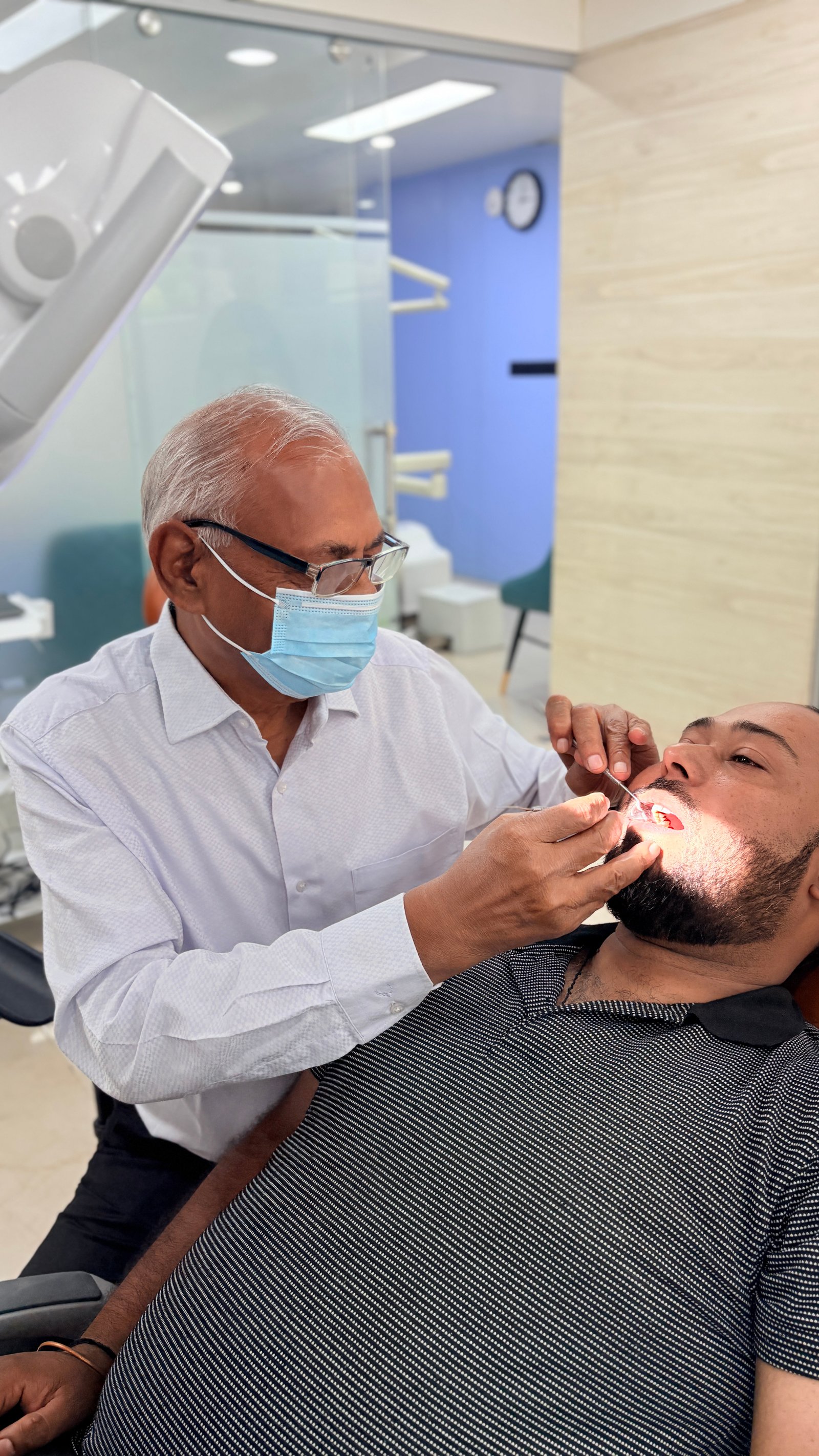 Dentist and assistant preparing procedure